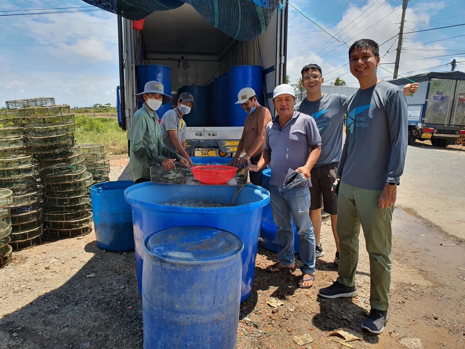 Photo: Founders at shrimp farm in Vietnam